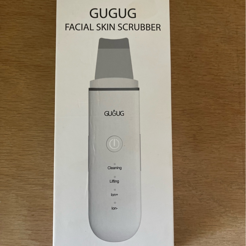 Gugug facial scrubber in original box with cord and instructions.